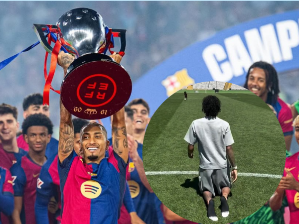 Raphinha cruza de rodillas el césped del Estadio Olímpico tras ganar LaLiga