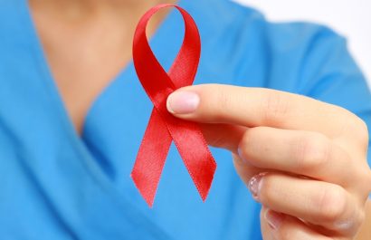 Nurse with  aids ribbon, isolated on white background