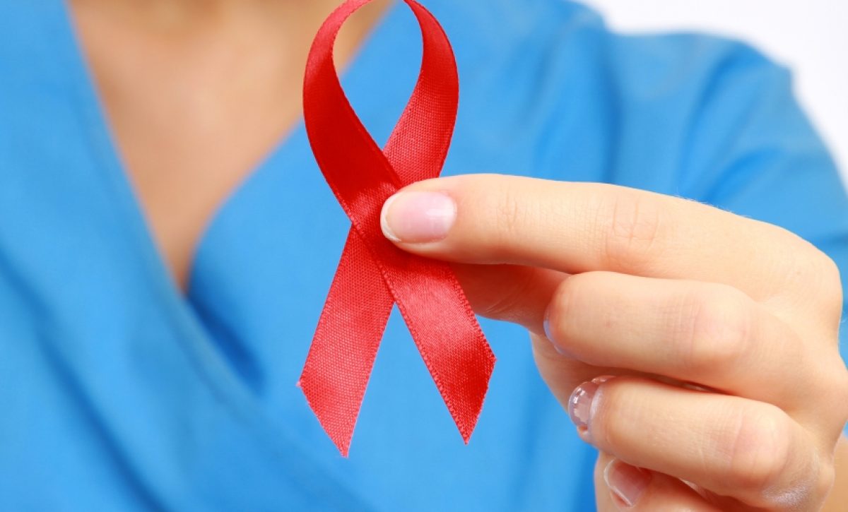 Nurse with  aids ribbon, isolated on white background