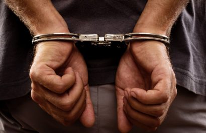 depositphotos_28109403-stock-photo-arrested-man-handcuffed-hands-at