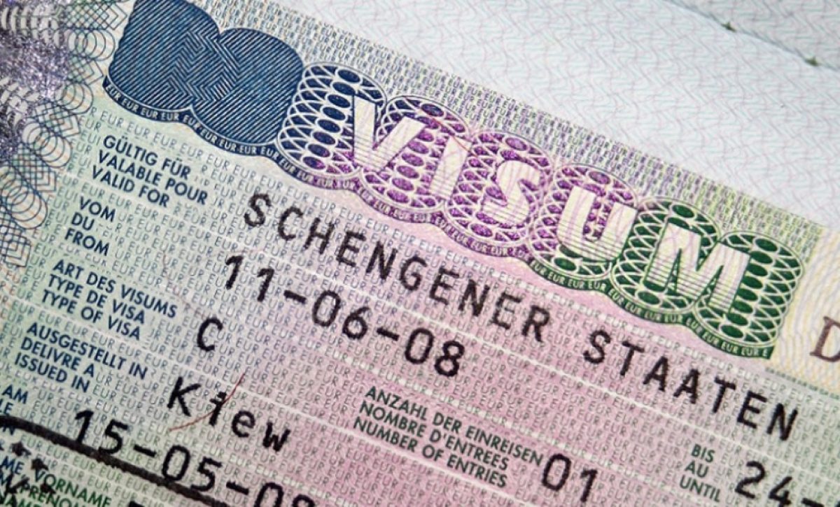 Close-up page of passport with Schengen visa