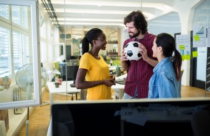 Group of graphic designers interacting with each other in office
