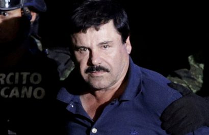 FILE PHOTO: FILE PHOTO: Recaptured drug lord Joaquin "El Chapo" Guzman is escorted by soldiers at the hangar belonging to the office of the Attorney General in Mexico City