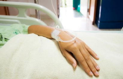 Close up of  iv drip in patient's hand in the hospital.