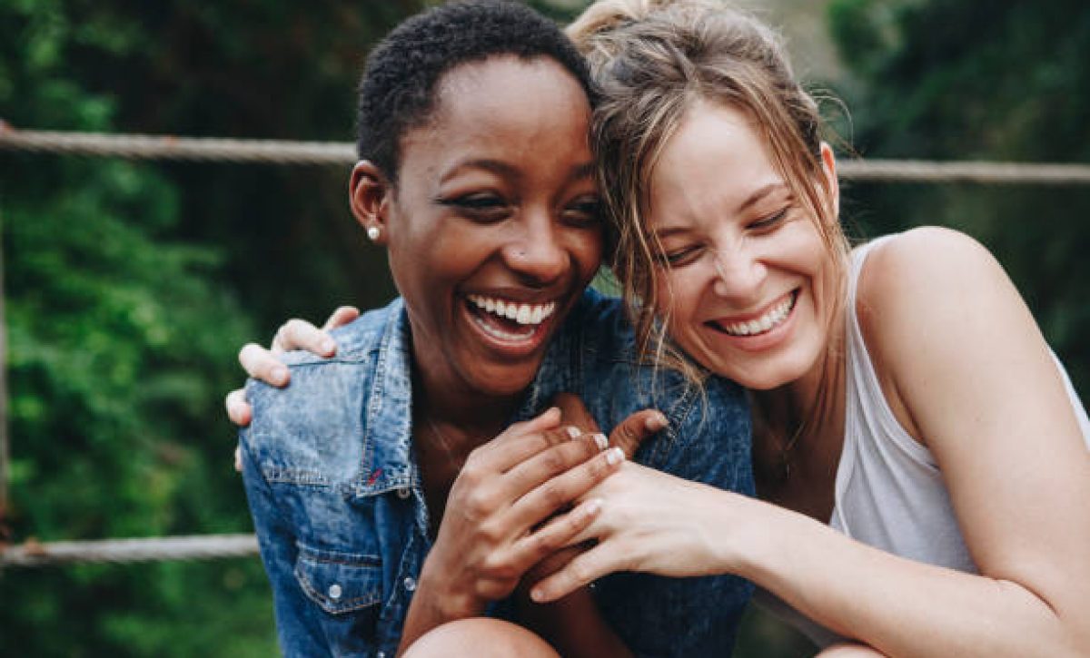 Happy friends holding each other