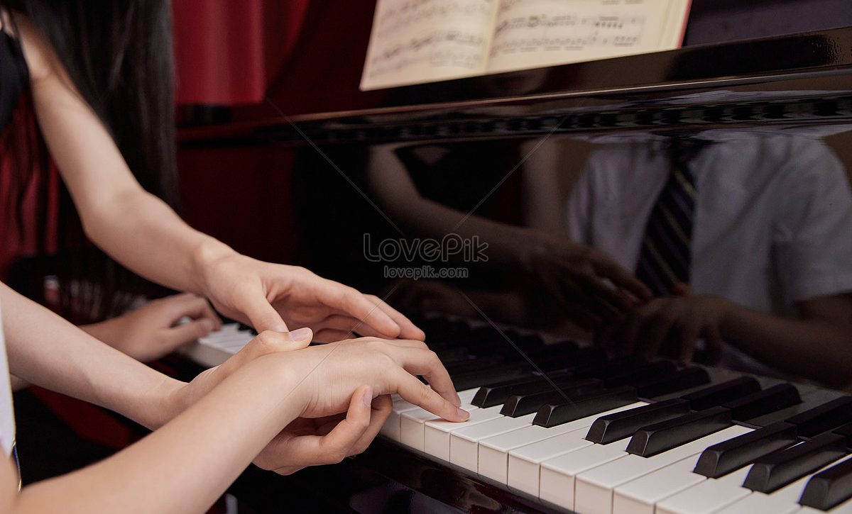 lovepik-music-teacher-teaches-children-to-play-piano-close-picture_501783743