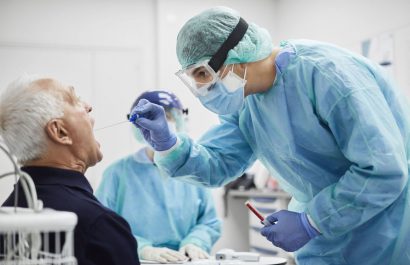 Doctor Taking Throat Swab Test From Male Patient, PCR
