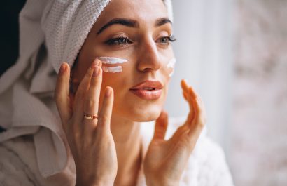 Woman applying face cream