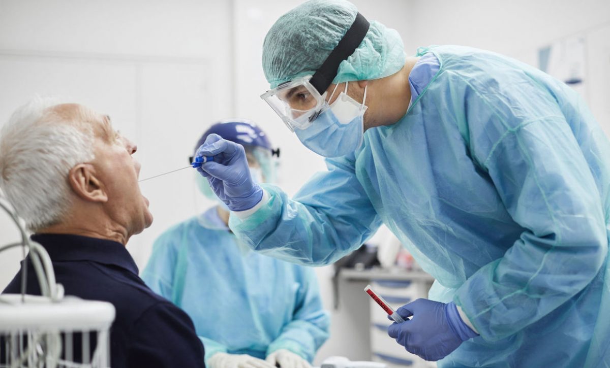 Doctor Taking Throat Swab Test From Male Patient, PCR