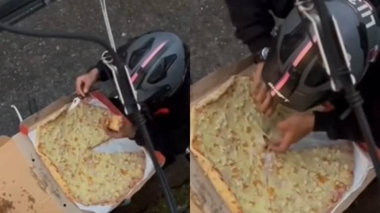 A un repartidor lo captaron disfrutando de una rebanada de pizza que estaba destinada a un cliente en México.